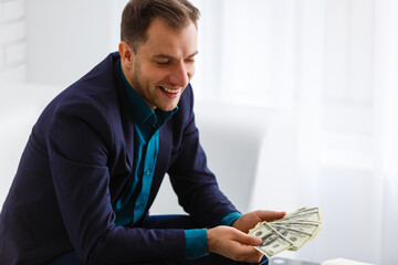Businessman counting hundred dollar bills. Money and trade concept
