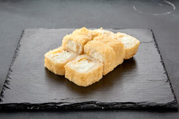 Tempura roll with chicken and cream cheese; a warm fusion roll combining crispy tempura batter with soft, rich flavors
