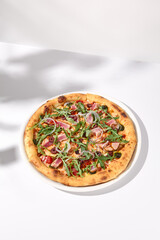 Artistic Niçoise-Style Tuna Pizza with Olives and Arugula on Shadowed White