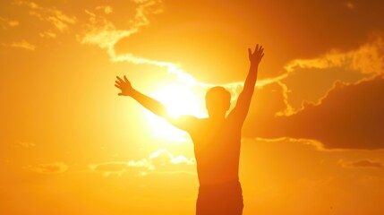 Fototapeta na wymiar Silhouette of a Person Reaching Out Towards the Setting Sun