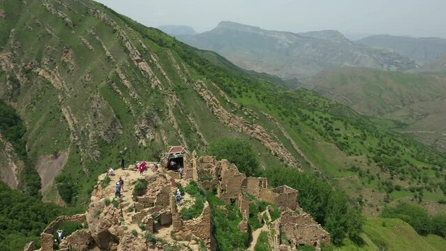 Aerial view of famous Gamsutl village on top of the mountain in Dagestan. Flying around shot