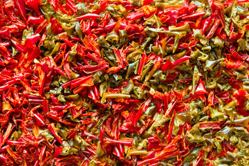 Peppers drying. Close up of fresh dried chopped red and green peppers. Background, texture of paprika.