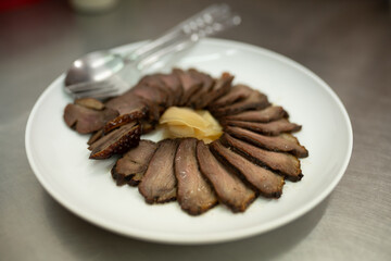 smoked duck meat in plate 
