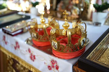 Church crowns on the throne in the church. Church wedding traditions