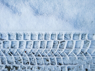 Tire tread prints on the ground. tire tracks. Tire tracks on a sandy road. Car tread prints on the...