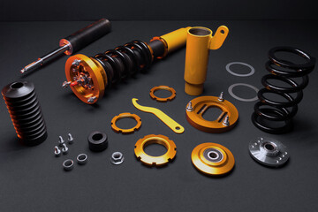 suspension tuning, coilovers, shock absorbers and front springs in yellow and gold colors for a...