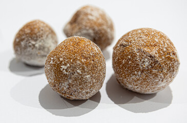 fresh donuts, bread, close-up view, on a light background, blurred background, bakery, baking, donut, sweets, sprinkled with powdered sugar
