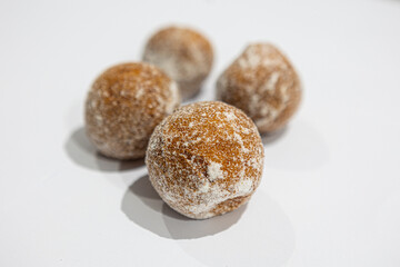 fresh donuts, bread, close-up view, on a light background, blurred background, bakery, baking, donut, sweets, sprinkled with powdered sugar
