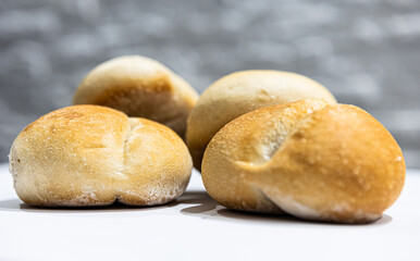 fresh roll, bread, close-up view, on a light background, blurred background, bakery, baking bread, rolls
