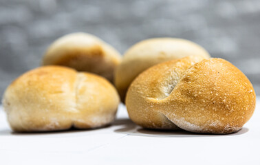 fresh roll, bread, close-up view, on a light background, blurred background, bakery, baking bread, rolls
