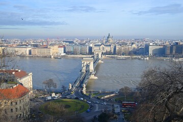Fototapeta na wymiar Aerial view of the famous chain bridge crossing the Danube river towards the city centre of Budapest, Hungary