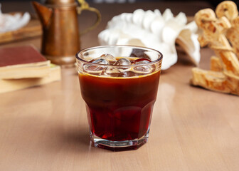 Coffee drink with ice in a glass glass.