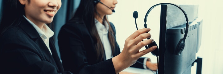 Business people wearing headset working in office to support remote customer or colleague. Call...