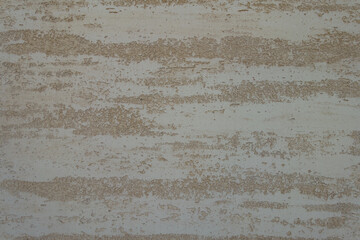 Surface of beige semi-smooth wall with stucco lace finish