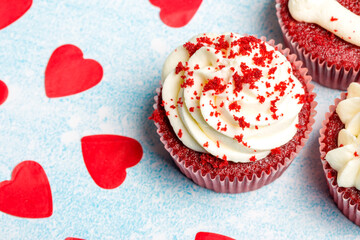 Valentine's day sweets. Red velvet cupcakes. Tasty cupcake with hearts. Festive background