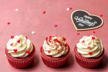 Valentine's day sweets. Red velvet cupcakes. Tasty cupcake with hearts. Festive background