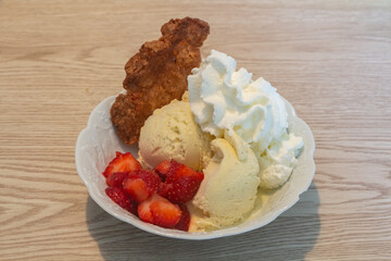 Homemade dessert with vanilla, icecream, strawberry, whipped cream and almond crisp - 730824959