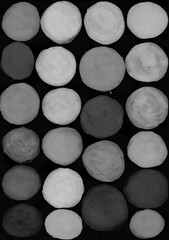 Gray watercolor circles isolated on a black background. Black and white round shapes drawn with paint, acrylic.  - 730825552