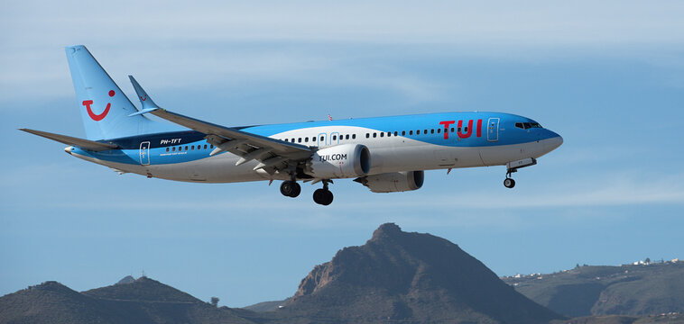 Tenerife, Spain February 4 st, 2024.Boeing 737 MAX 8 TUI Airlines flies in the blue sky. Landing at Tenerife Airport