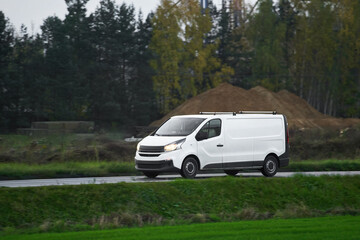 Commercial van on the road. Delivery van close-up mockup isolated. Final destination shipping truck...