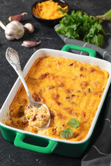 cheesy smoked sausage grits bake in ceramic dish