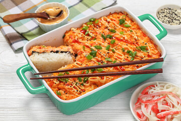 sushi bake with salmon, rice, seaweed, crab meat