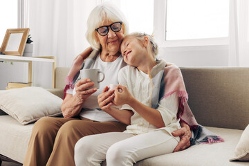 Grandmother girl couch granddaughter child