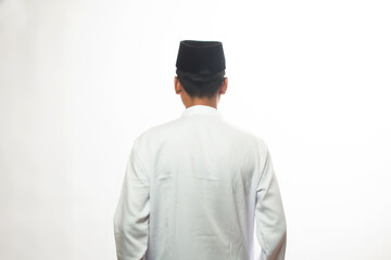 Asian Muslim Muslim man standing straight and back to camera, isolated white studio, muslim man concept