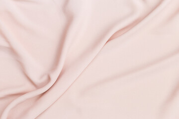 Obraz premium Closeup waving pink fabric background, blank pink fabric texture background