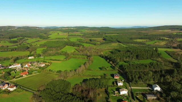 Aerial footage of green fields in Castriz village in Santa Comba, A Coruna, Galicia, Spain