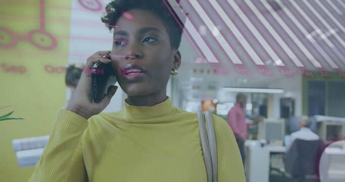 Image of financial data processing over biracial businesswoman using smartphone