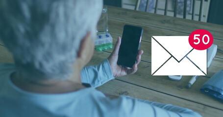 Image of mail icon with numbers growing over senior woman using smartphone at home