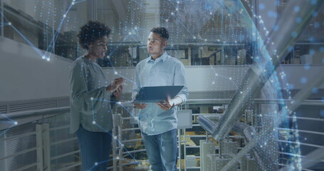 Image of globe and data processing over diverse business people in office