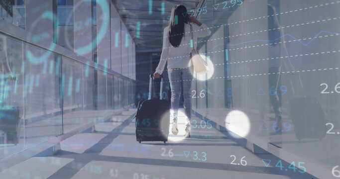Image of financial data processing over biracial businesswoman in airport