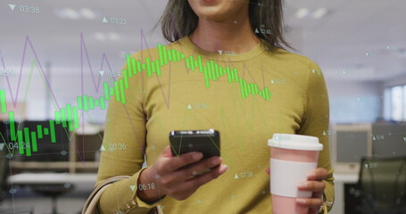 Image of financial data processing over biracial businesswoman using smartphone