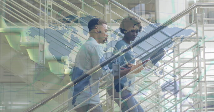 Image of financial data processing over biracial business people on office staircase