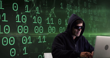 Image of caucasian male hacker over binary code on green background