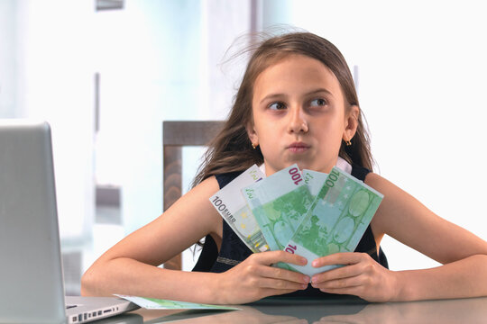 Conceptual image: Best investments for beginners. Young beautiful girl working online and counting Euro money.