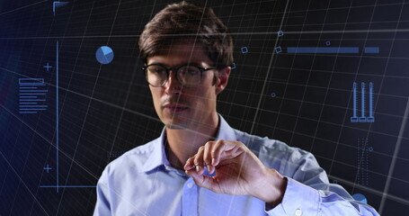 Image of neon shapes over caucasian man using touchscreen