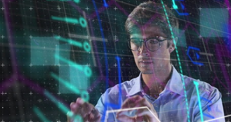 Image of neon shapes over caucasian man using touchscreen