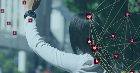 Image of network of connections with icons with woman stopping taxi in city
