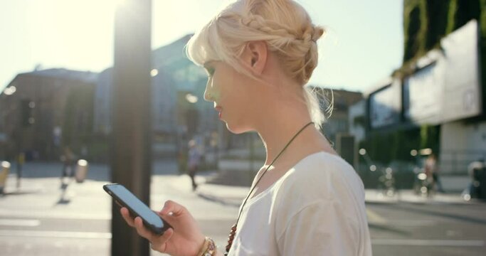 Woman, profile and walking in city with smartphone, travel or commute with social media update and tech outdoor. Commuter using phone, journey and tourism with internet, communication and contact