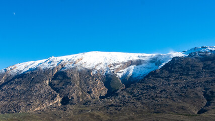 Snow-capped peaks of Breede Valley's distant mountains on a chilly day in Worcester, South Africa