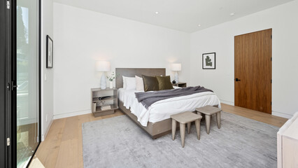 Cozy bedroom featuring a comfortable bed and glass panels