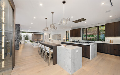 a kitchen with a large marble island in the center of it