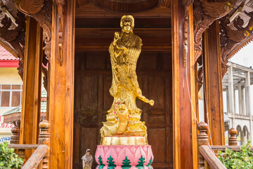 Bangkok, Thailand - January,14, 2024: Golden Guan Yin or goddess of mercy statue at the Institute...