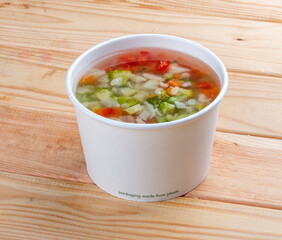 Ministerone - vegetable soup. Healthly food. Takeaway food. On a wooden background.