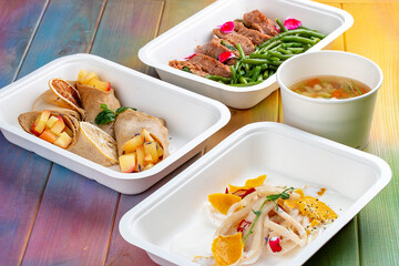 Colorful and nutritious meal kits prepared in eco-friendly containers for a convenient and healthy on-the-go meal.