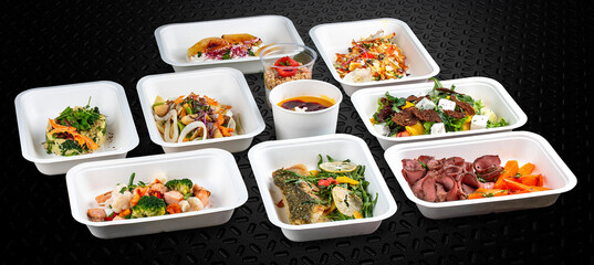 Colorful and nutritious meal kits prepared in eco-friendly containers for a convenient and healthy on-the-go meal.