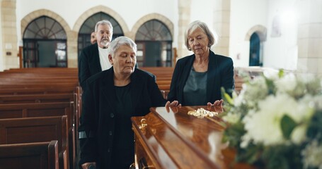 Senior women, coffin and funeral in church for memory, support and condolences with religion with family. Community, friends and together for death, loss and service with empathy, faith and casket - obrazy, fototapety, plakaty